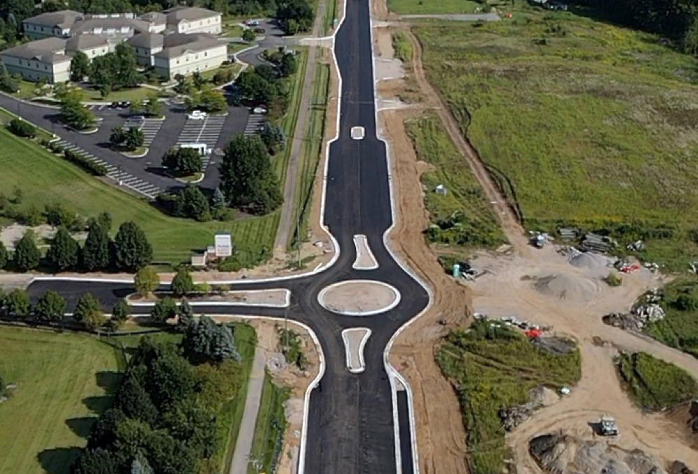 Aerial view of a newly paved road and roundabout