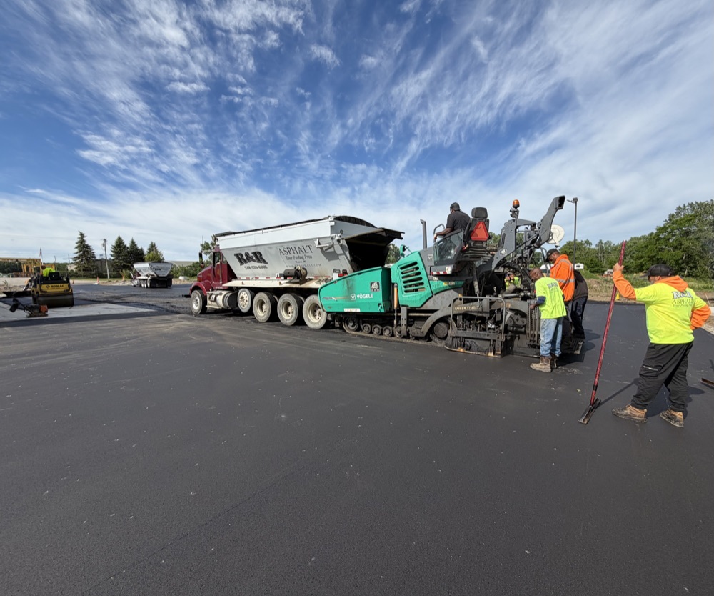 R&R Asphalt crew paving a road